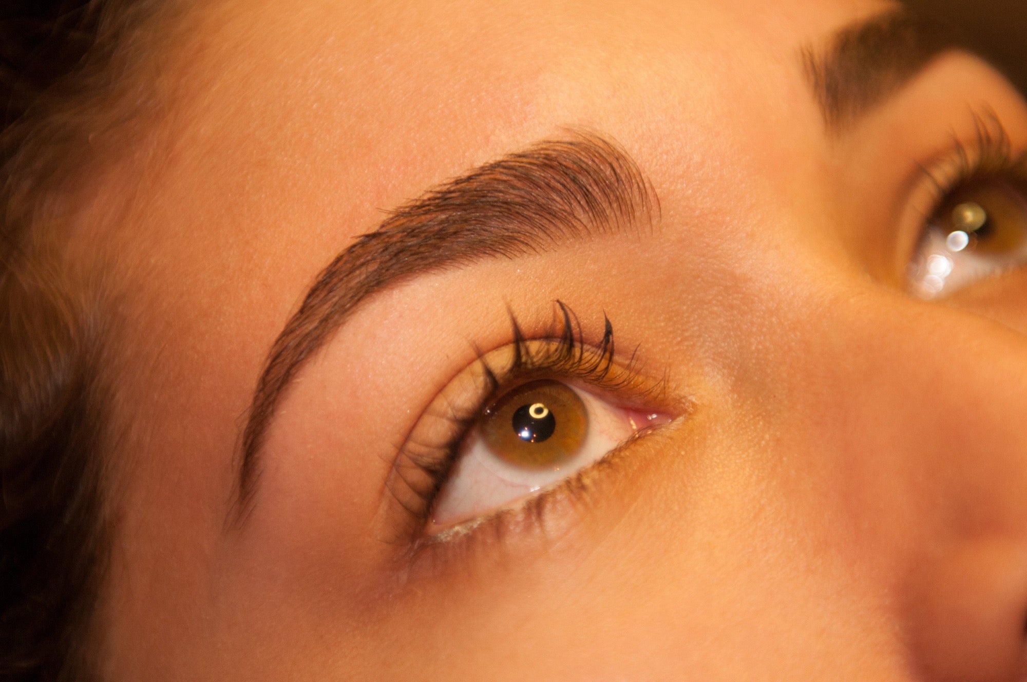 Close-up of healthy, clear skin and a sculpted brow